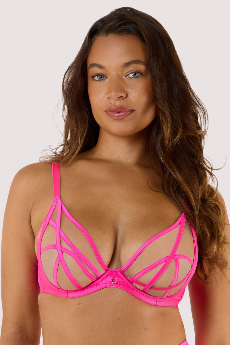 model wears the neon Pink plunge bra, highlighting the electric pink satin caged straps and sheer mesh cups with underwired support.