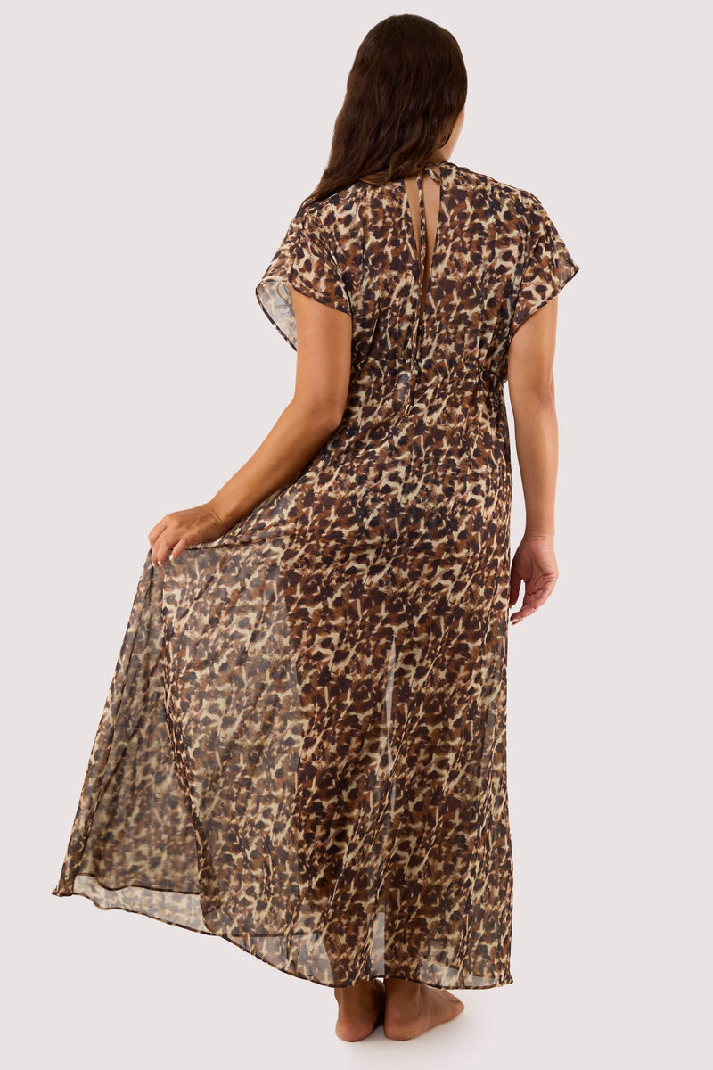 Model Back view of the Zarah Animal Print Georgette Long Beach Kaftan, showcasing its lightweight sheer fabric, flowing silhouette, and tie detail at the neckline.