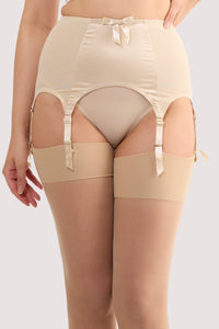 Model wears a champagne satin 6 strap retro everyday suspender with six adjustable straps, soft and smooth finish with a matching brief.