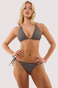 Model wears a margot black & white gingham scallop trim tie side bikini briefs with textured gingham fabric, tie-side style for adjustable fit with matching triangle bikini top.