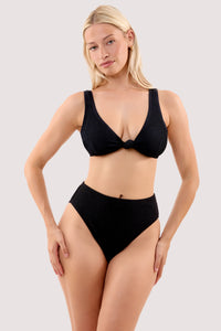 Model wears a selene black crinkle knot front bikini top with a matching high waist bikini bottom.