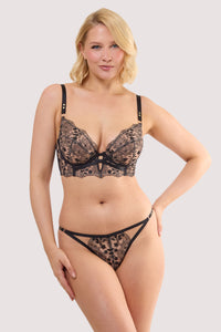 Model wears a cindy black floral embroidery longline bra with scalloped lace edging, with a matching embroidery thong.