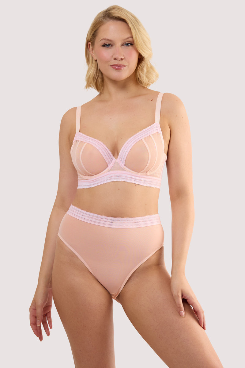 Model wears a icon blush pink microfiber moulded cup bra with light pink moulded microfibre and underwired, full cups with a matching high waist thong.