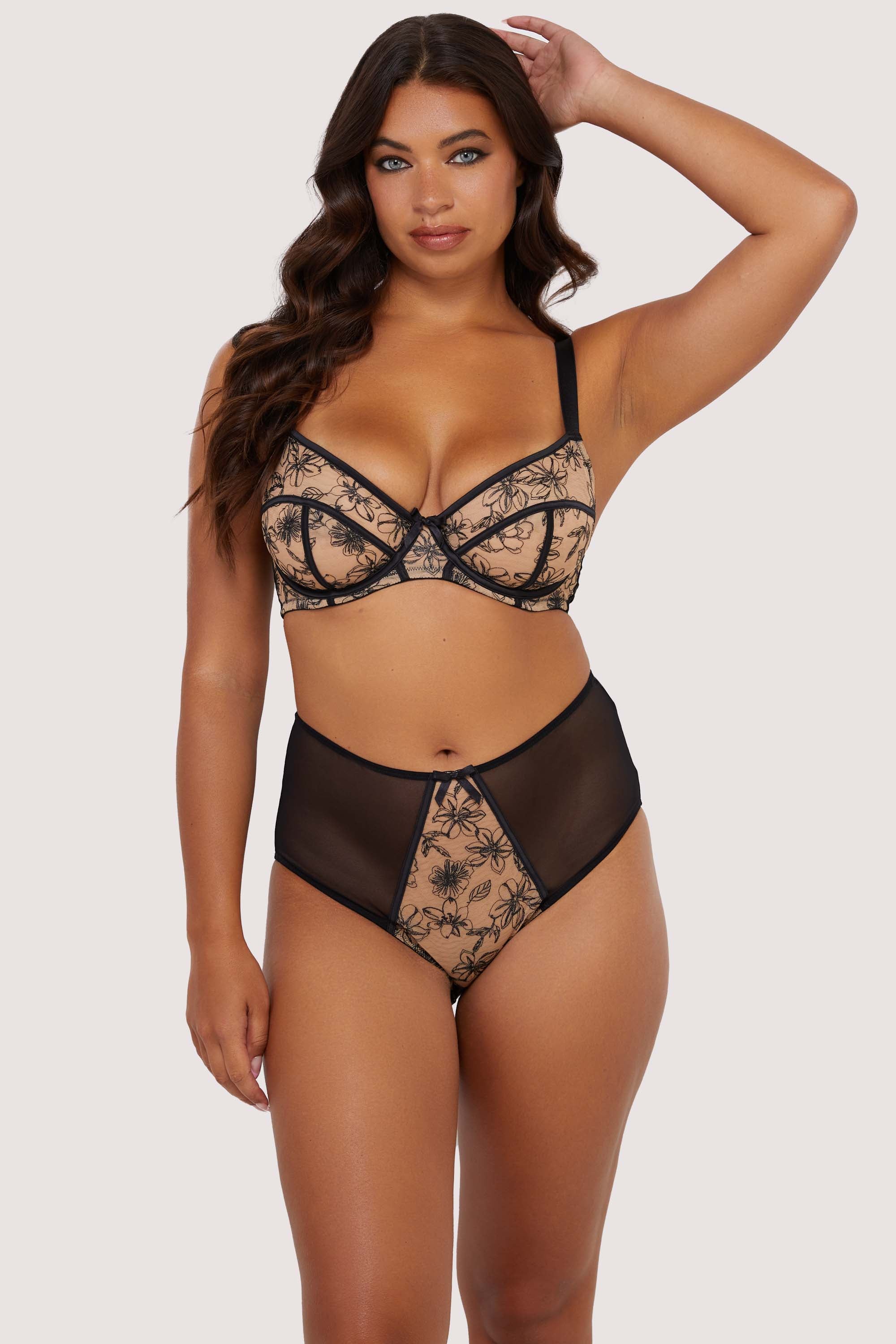 Model wears contrast black embroidery bra and high waisted brief set, featuring nude mesh with black floral embroidery and supportive balconette underwire cups