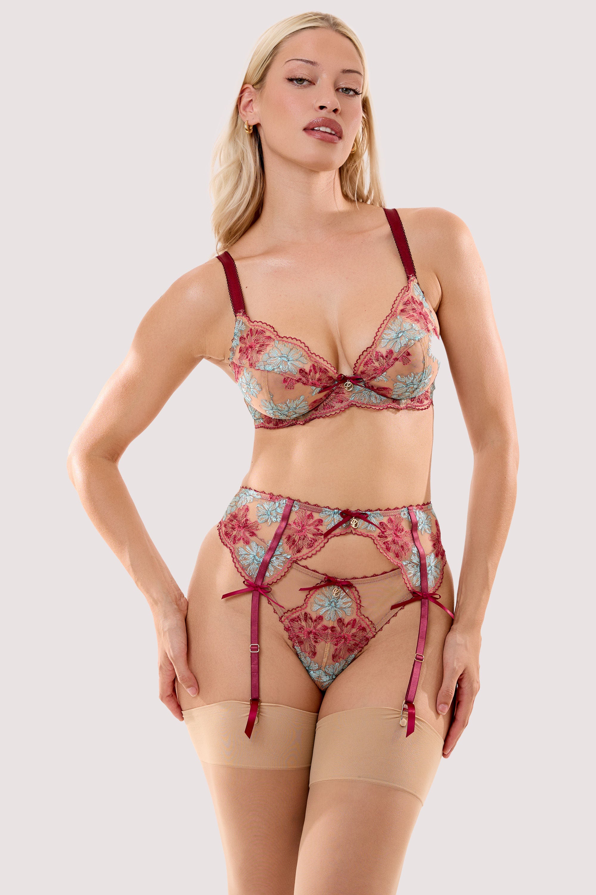 Model wears a persephone ivory & wine floral embroidery suspender belt with a matching thong and bra.