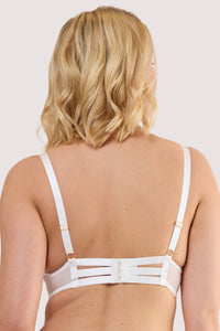 Model shows the back of a willow white floral embroidery bra with adjustable shoulder straps with gold-toned hardware.