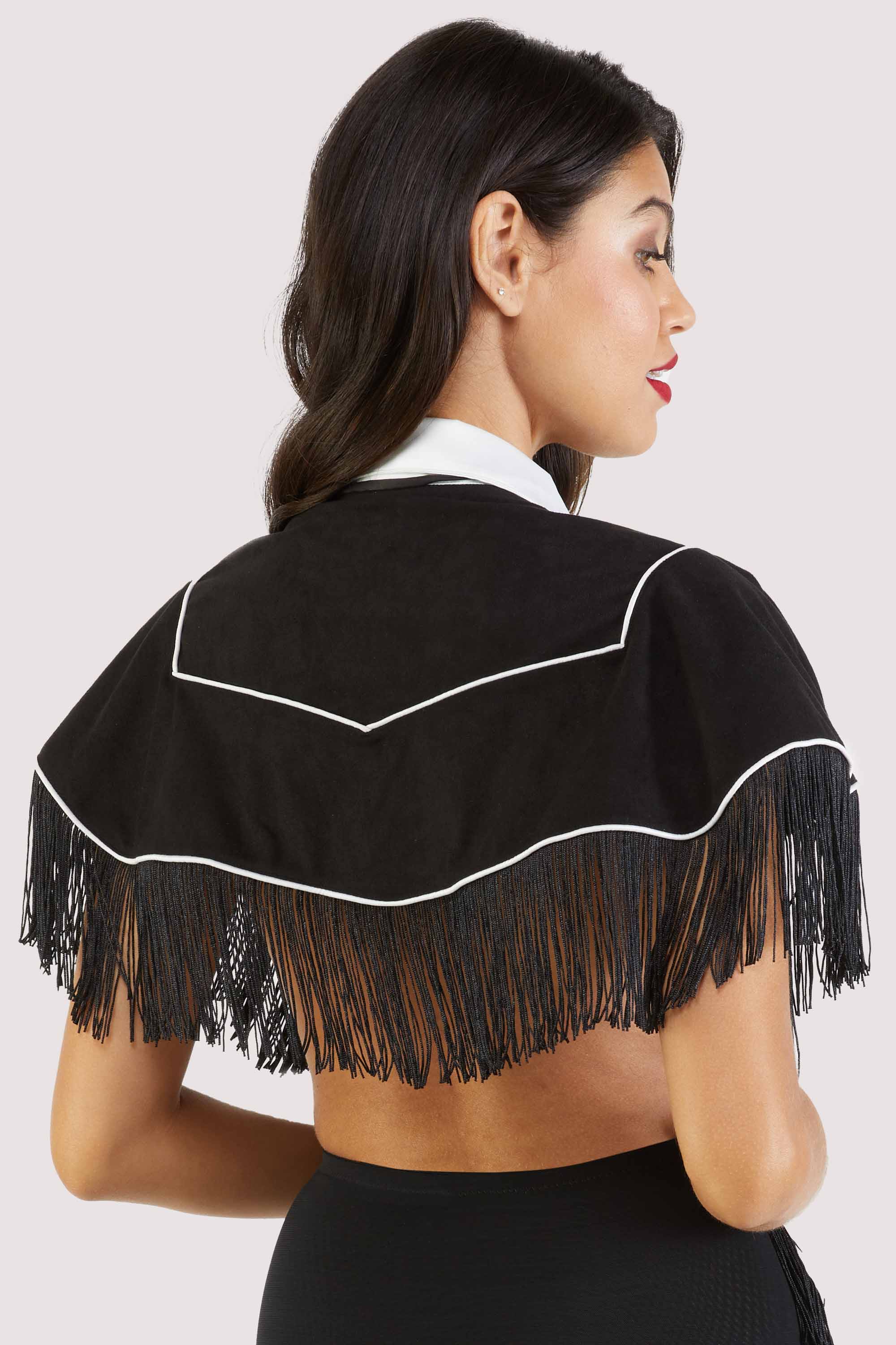 model shows us the back of the Billie western cowboy fringe cape