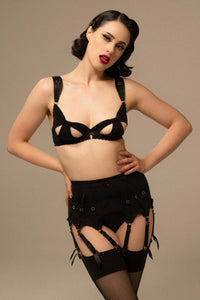 model wears Anita black mesh cut out bow bra with lingerie set