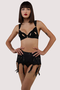 model wears Anita black mesh cut out bow bra with lingerie set