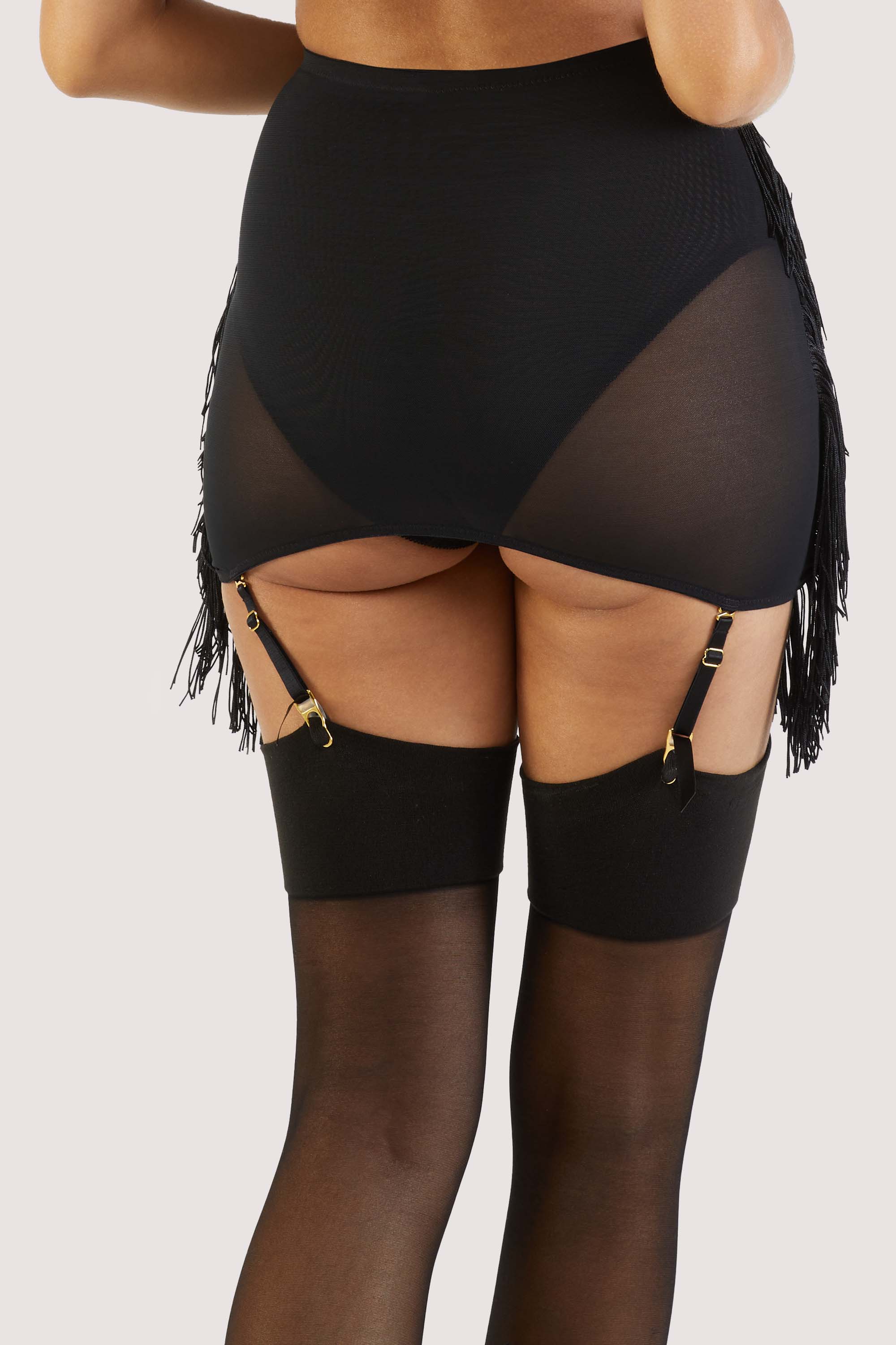 model shows us the back of Billie western cowboy fringe grindle with suspender