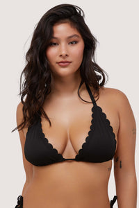 model wears black scalloped triangle bikini top with halter tie