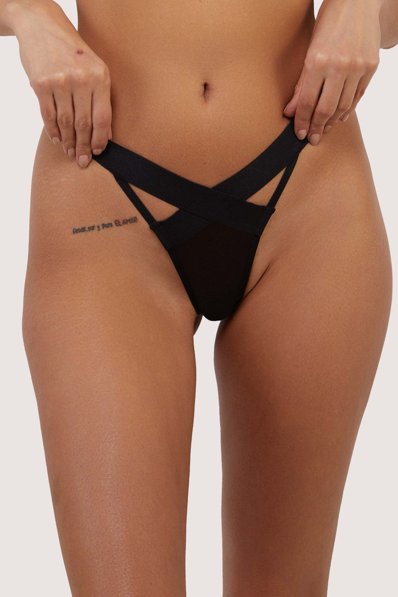 model wears black mesh elastic thong