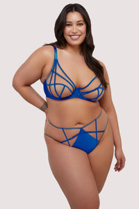 model wears cobalt blue bra and high waist brief lingerie set