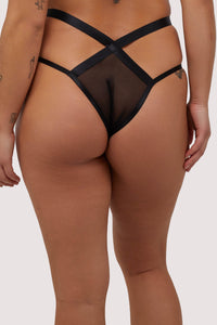 Model shows black mesh back of Brazilian briefs