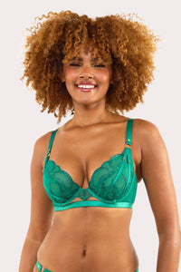 Model wears forest green plunge bra with embroidery, scalloped lace edge and gold ring strap accents