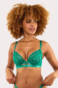 Model wears forest green plunge bra with embroidery, scalloped lace edge and gold ring strap accents