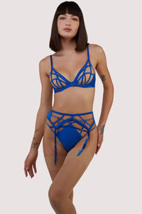 model wears cobalt blue lingerie set with suspender belt