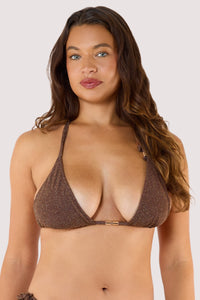 Model wearing shimmering bronze triangle bikini with tie-side bottoms