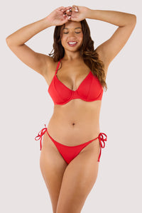 Model wears red bikini set featuring underwired halter neck top and adjustable tie-side bikini bottoms.