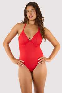 Model Wearing Underwired Halterneck Swimsuit with plunge neckline, supportive cups, halterneck tie, high-leg cut, and low scoop back.